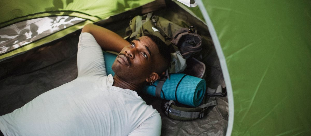 A sleeping pad inside a tent at a backcountry campsite.